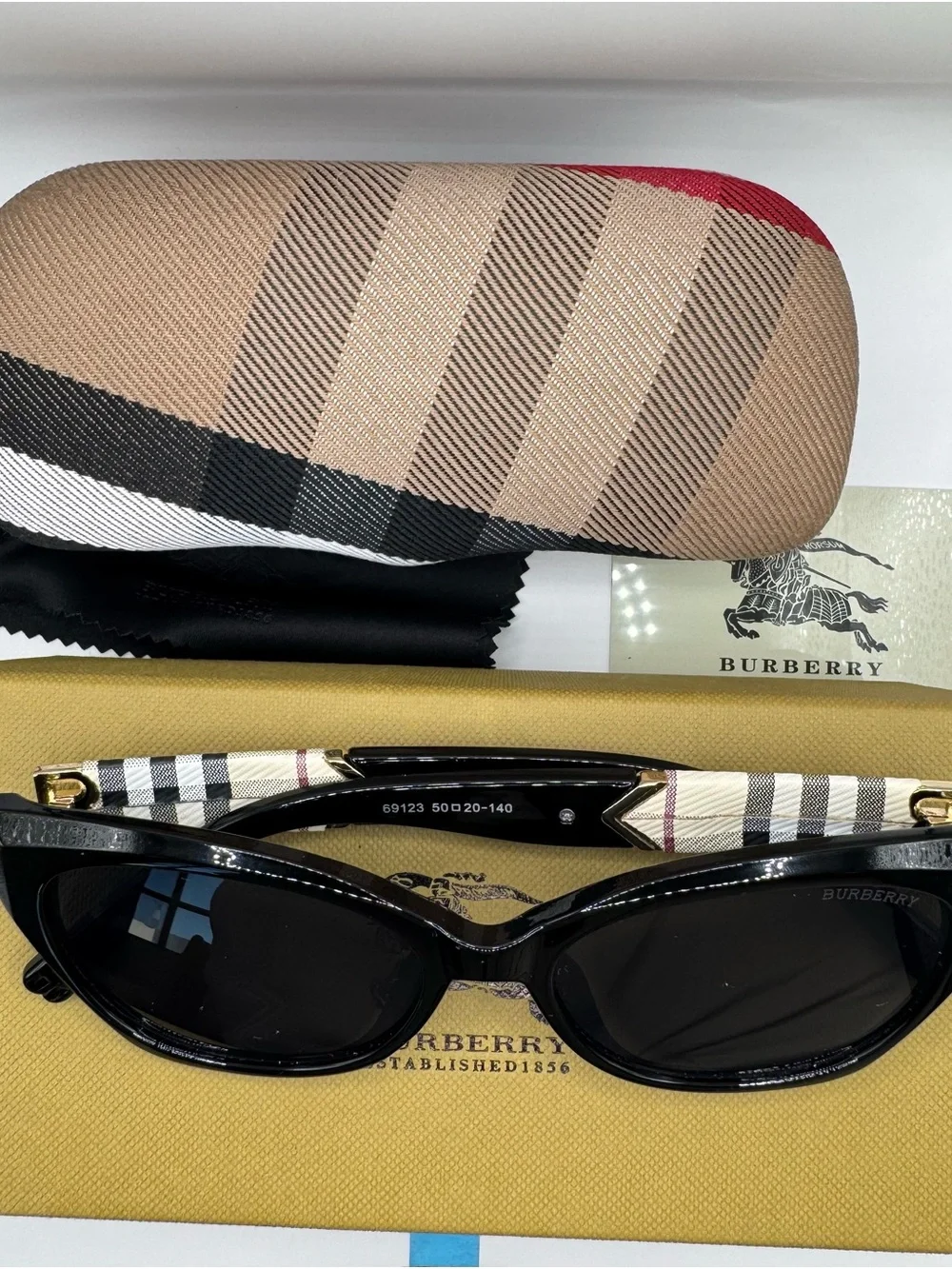 Burberry Black Cat-Eye Sunglasses with Beige Check Arms and Gold Accents